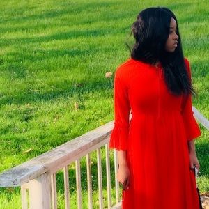 Long sleeve red dress comes down to the ankle on model height 5’7 in a half.